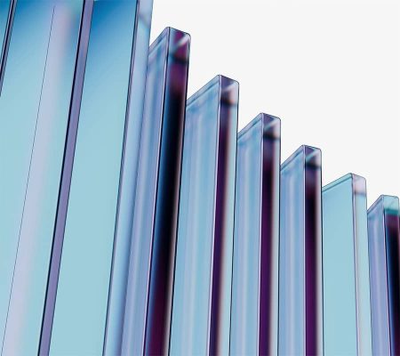 permaglass Rows of transparent blue glass panels, made from composite materials, reflect light on white.